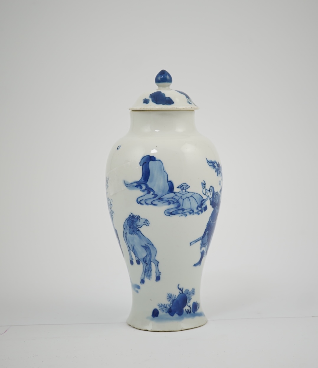 A Chinese blue and white baluster vase, early Kangxi, and associated cover